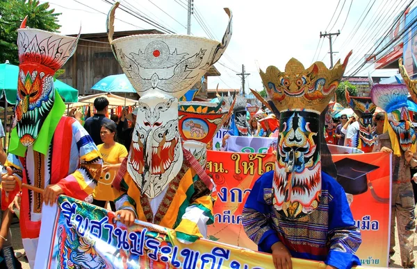 Loei province, Thailand- June 28,2014: Unidentified men wear ghost costume on parade at  Phi Ta Khon or Ghost Festival at Dan Sai district, Loei province, Thailand.