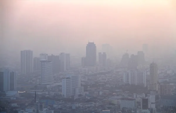 Low visibility caused by pollution problem in urban area during sunset, Bangkok, THAILAND.