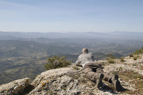 Lying man looking to the landscape