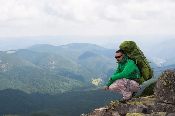 Happy hiker in mountains