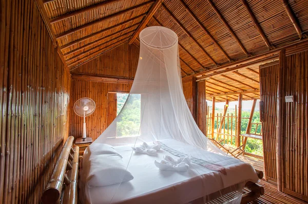 Rural style bedroom with canopy bed , bamboo decorated. Very pop