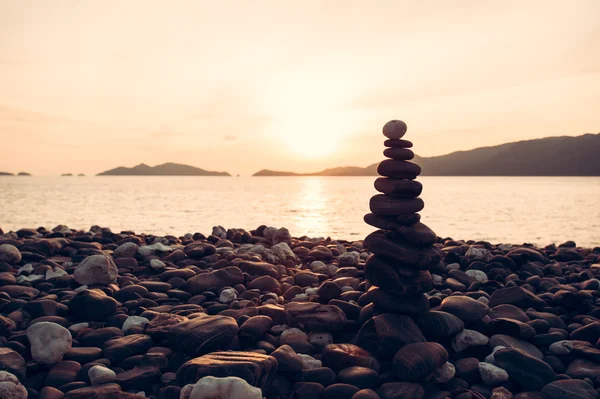 Zen meditation background,Balanced stones stack close up on sea beach