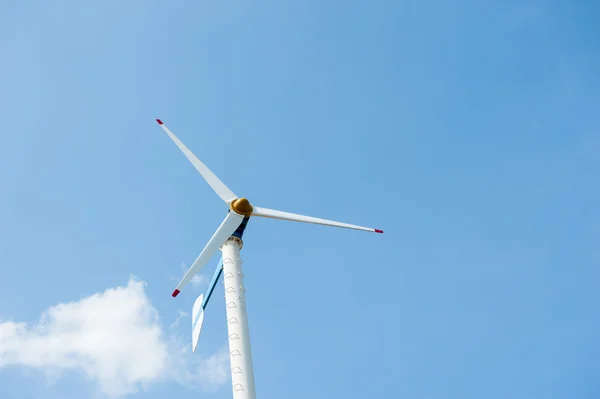 Eco energy - wind turbines ,blue sky background