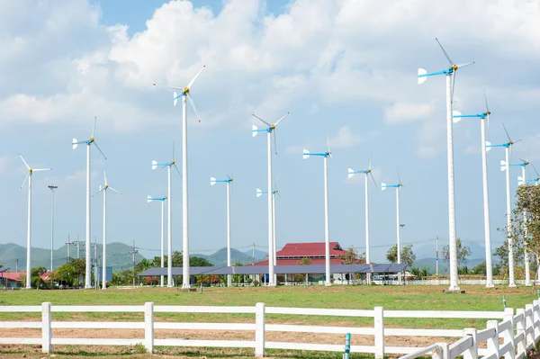 Eco energy - wind turbines ,blue sky background