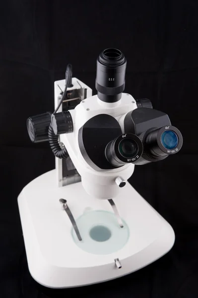 Microscope isolated on white background , This is a genuine piece of equipment that would be used in a real lab.