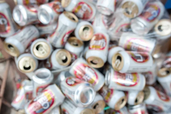 Blur trash cans of beer