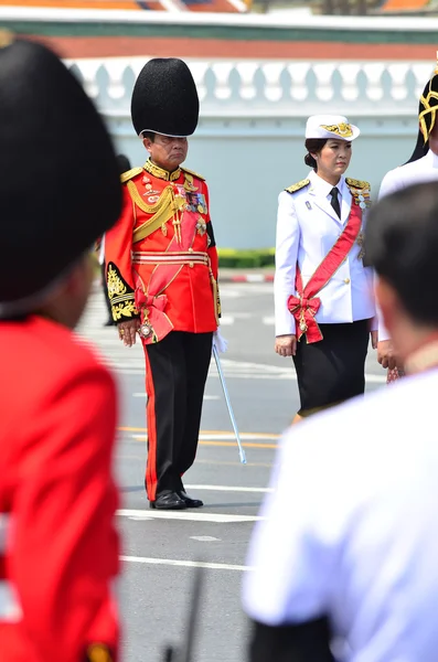 Soldiers in parade uniforms marching during the royal funeral of Her Royal Highness Princess Bejaratana