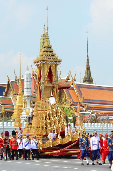 Soldiers in parade uniforms marching during the royal funeral of Her Royal Highness Princess Bejaratana