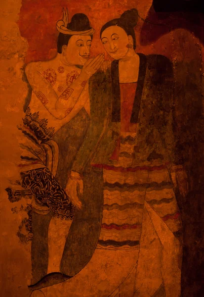 Mural painting of a man whispering to the ear of a woman at Wat