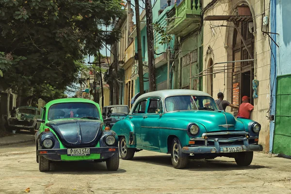 CUBA, HAVANA-JULY 6, 2015: Classic american cars on a street in Havana. Cubans use the retro cars as taxis for tourists