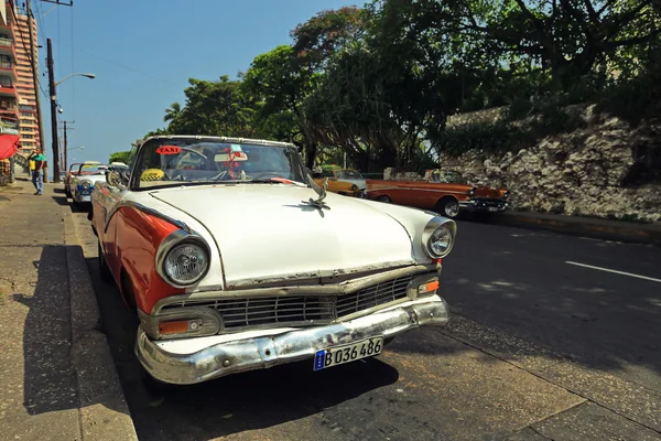 CUBA, HAVANA-JUNE 26, 2015: Classic american car on a street in Havana. Cubans use the retro cars as taxis for tourists