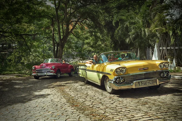 CUBA, HAVANA-JUNE 27, 2015: Cubans go to the classic american old car on the streets of Havana