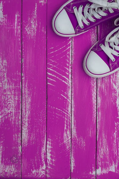 Vertical background with sneakers color purple