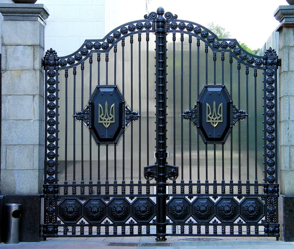 Beautiful metal gates with  emblem of Ukraine near the Ukrainian parliament, Kiev.