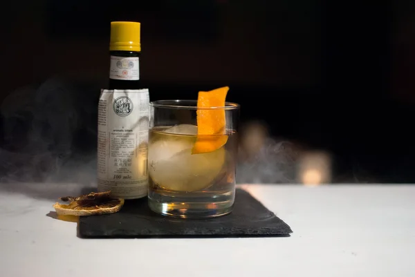 Old fashioned cocktail with ice ball