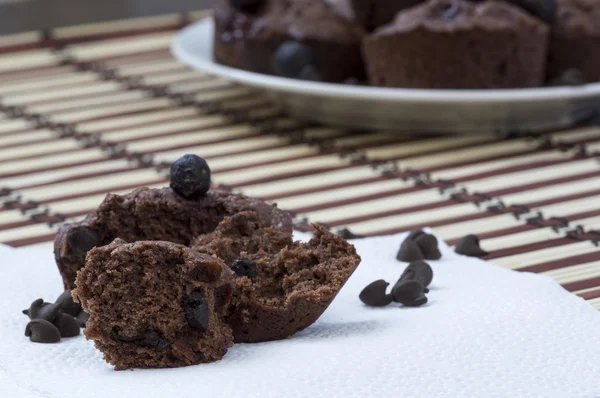 Homemade chocolate muffin with chocolate chips close up