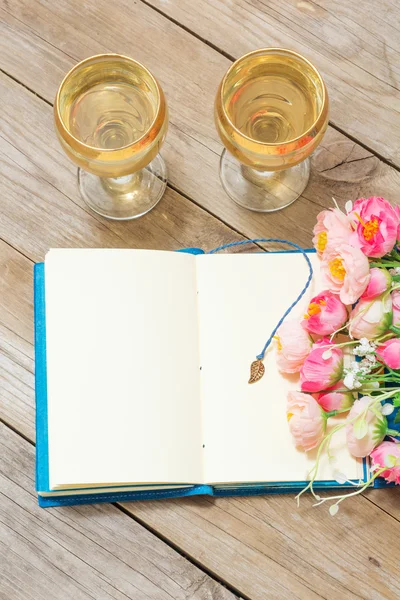 Notepad, white wine and flowers