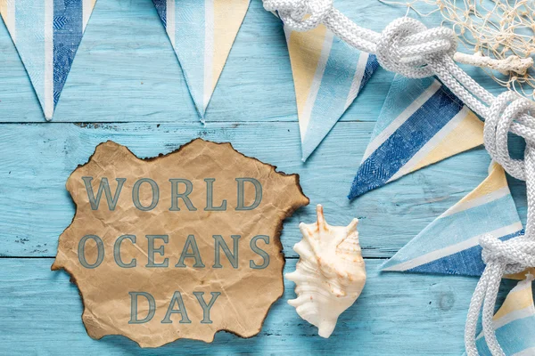 Text: World oceans day. Written on old paper