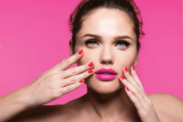 Woman with pink lipstick and manicure