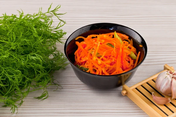 Pickled carrot  on wooden background