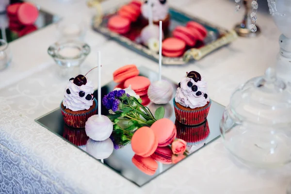 Variety of tasty appetizing sweet desserts on the wedding table.