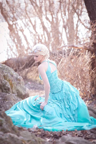 Beautiful fairy in a long turquoise dress