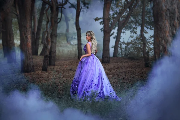 Beautiful girl in a purple dress