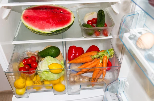 Fridge filled with fruits and vegetables