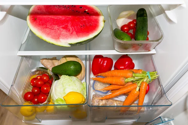 Fridge filled with fruits and vegetables