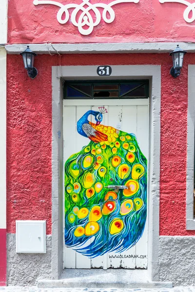 Funchal, Portugal - July 2, 2016: The art of open door in the street of Santa Maria. A project which aims to 