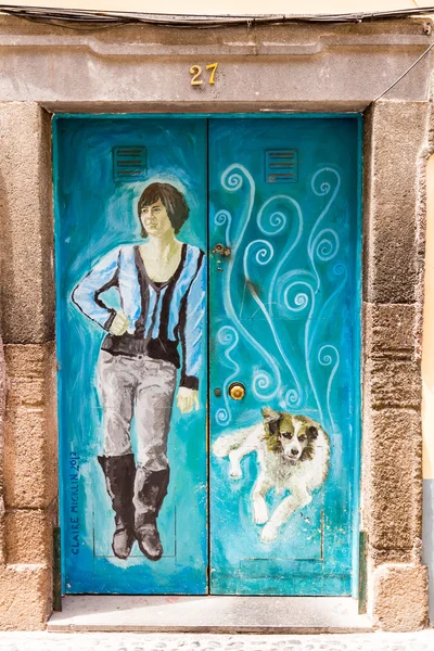 Funchal, Portugal - July 2, 2016: The art of open door in the street of Santa Maria. A project which aims to \