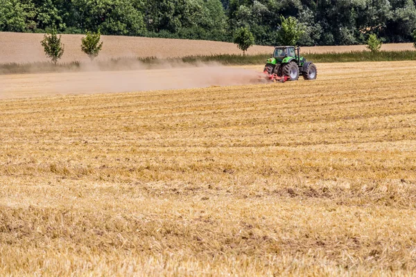 Field of cut wheat and bright blue sky