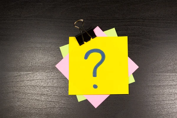 Question mark on a sticky note
