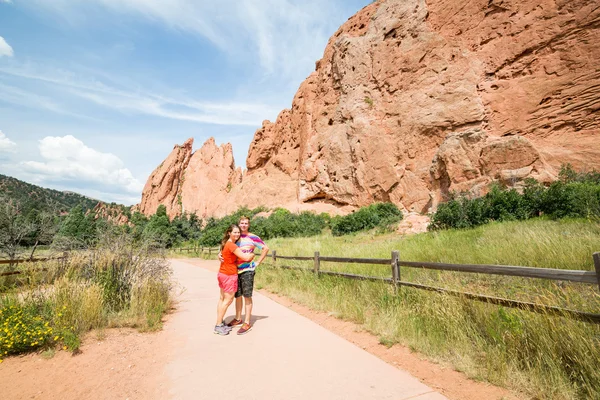 Young couple in the Garden of the gods park, USA