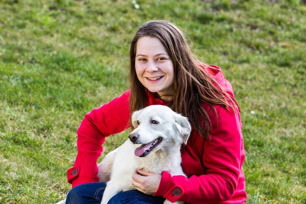 Young woman with dogs in the garden