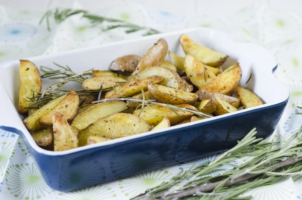 Slices of baked potatoes with rosemary