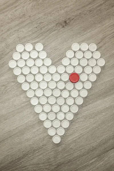 Heart shape made with recycled plastic caps