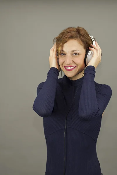 Portrait of curly hair young woman with headphones