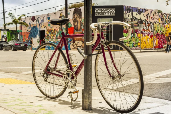 Classic bike locked in side walk at Wynwood creative and arts di