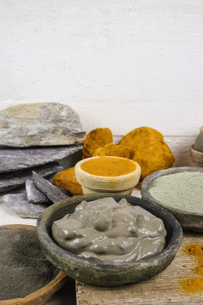 Ancient minerals - ochre, green  and blue clay powder and mud mask