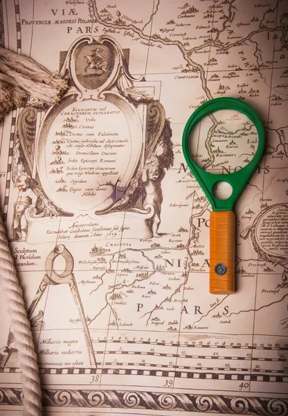 Magnifier on old, vintage, antique map. Background