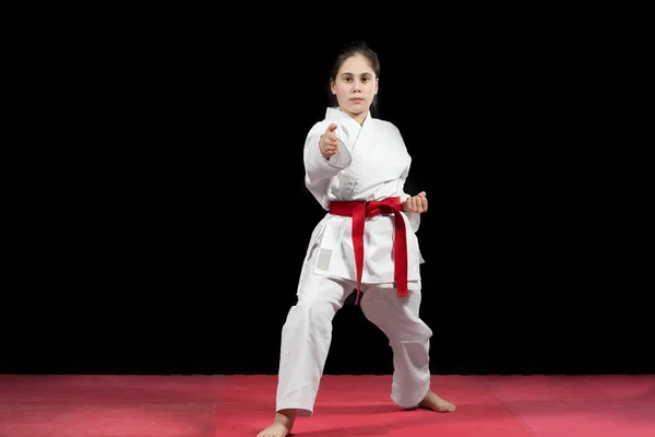 Young girl preforming karate martial arts