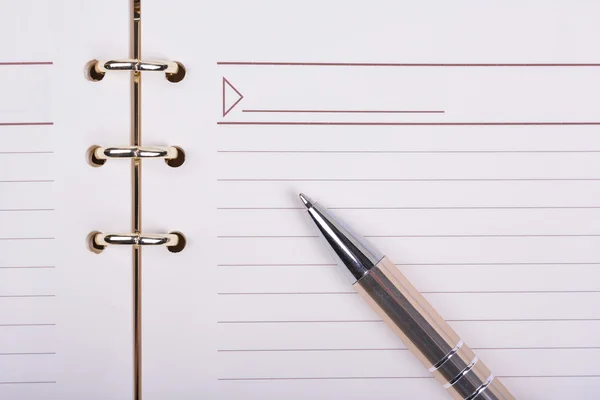 Ball pen on blank notebook sheet