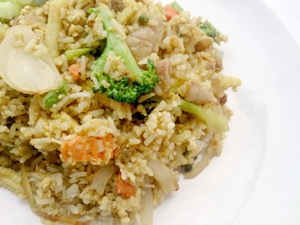 Close up green curry fried rice on dish, Delicious fried rice with chicken green curry, Thai Food