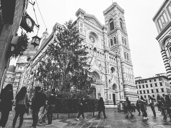 Italy tourists next to Florence Cathedral and Christmas tree