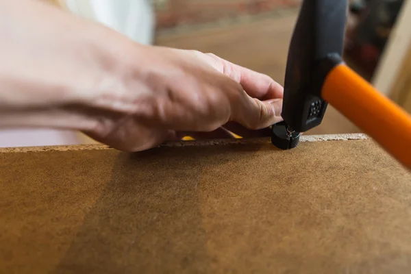 Man hammers a nail