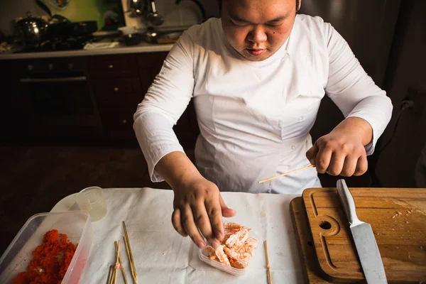 Chef preparing shrimps