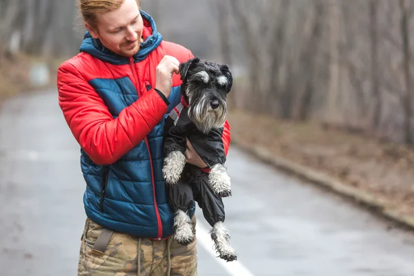 Man holding his dog