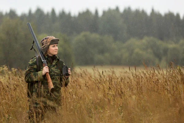 Woman hunter in forest