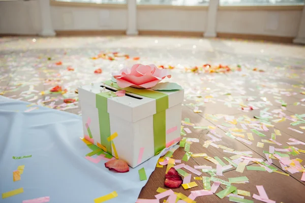 Presentation box on wedding ceremony with ribbons confetti